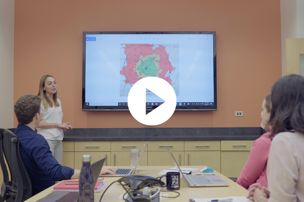 Rachel Seitz presents map data at a meeting